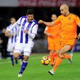Real Sociedad's forward Carlos Vela (L) vies with Valencia's Tunisian defender Aymen Abdennour (R) during the Spanish league football match December 10, 2016