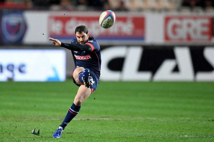 Racing's Fijian lock Leone Nakarawa (right) grabs the ball in a line out during the French Top 14 rugby union match against Grenoble on March 4, 2017 at the Stade des Alpes in Grenoble, central eastern France