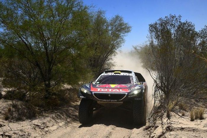 Peugeot's French driver Stephane Peterhansel and co-driver Jean Paul Cottret compete during the Stage 11 of the Rally Dakar 2016 between La Rioja and San Juan, Argentina, on January 14, 2016