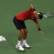 Novak Djokovic smashes his racket after losing a point against Roberto Bautista at the Shanghai Masters