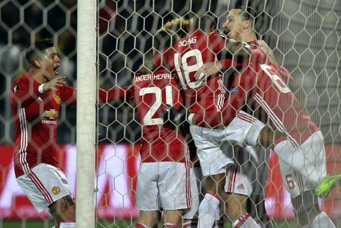 Manchester United players celebrate during their UEFA Europa League round of 16 football match against Rostov at Olimp-2 Arena in Rostov-on-Don on March 9, 2017