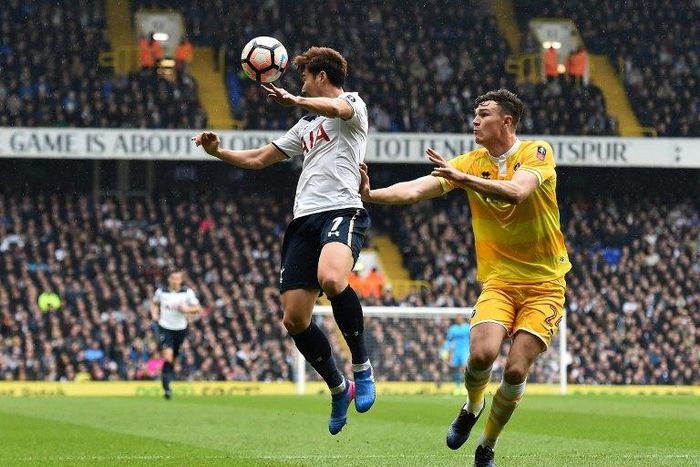 Millwall's defender Jake Cooper (R) vies with Tottenham Hotspur's striker Son Heung-Min during the English FA Cup quarter-final football match between Tottenham Hotspur and Millwall at White Hart Lane in London, on March 12, 2017