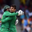 Pakistan's Shadab Khan (R) celebrates with team captain/wicketkeeper Sarfraz Ahmed after dismissing West Indies' Sunil Narine