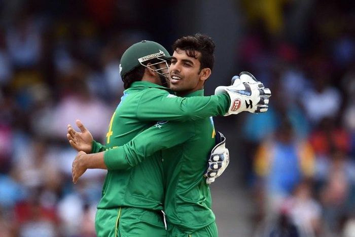 Pakistan's Shadab Khan (R) celebrates with team captain/wicketkeeper Sarfraz Ahmed after dismissing West Indies' Sunil Narine