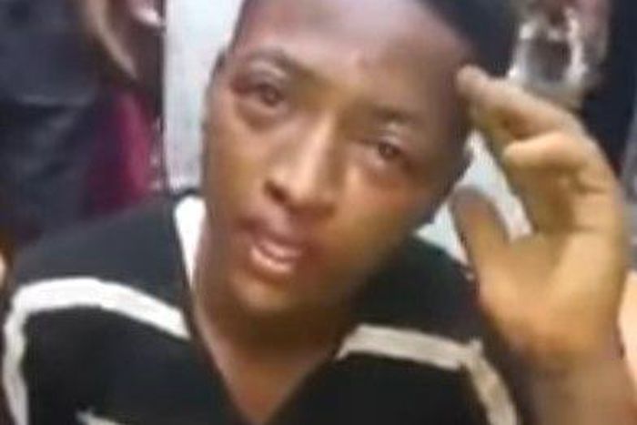 A teenager accused of robbing with a toy gun is seen in tears.