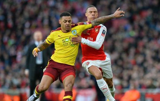 Burnley's English striker Andre Gray (L) vies with Arsenal's English defender Kieran Gibbs during the English FA Cup fourth round football match between Arsenal and Burnley at the Emirates stadium in London, on January 30, 2016