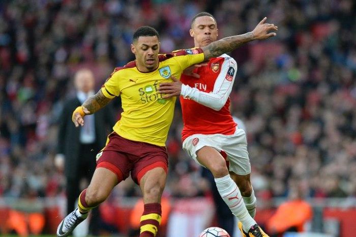 Burnley's English striker Andre Gray (L) vies with Arsenal's English defender Kieran Gibbs during the English FA Cup fourth round football match between Arsenal and Burnley at the Emirates stadium in London, on January 30, 2016