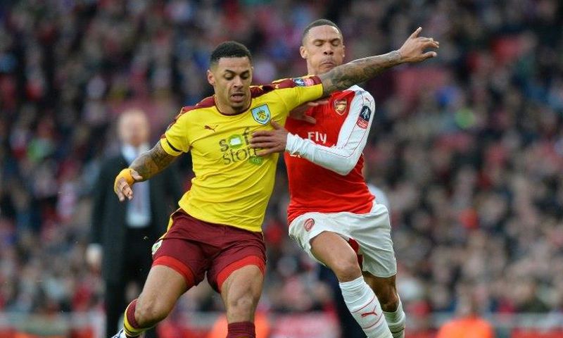 Burnley's English striker Andre Gray (L) vies with Arsenal's English defender Kieran Gibbs during the English FA Cup fourth round football match between Arsenal and Burnley at the Emirates stadium in London, on January 30, 2016
