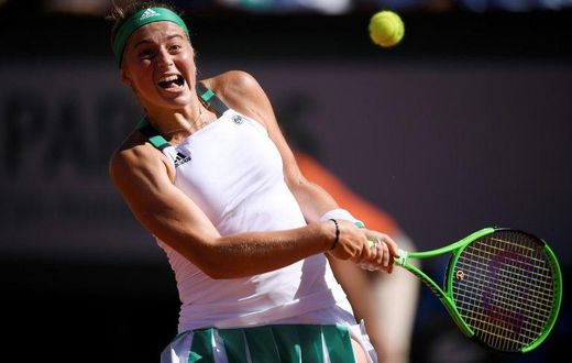 Latvia's Jelena Ostapenko returns the ball to Romania's Simona Halep during their final match at the Roland Garros 2017 French Open on June 10, 2017 in Paris