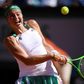 Latvia's Jelena Ostapenko returns the ball to Romania's Simona Halep during their final match at the Roland Garros 2017 French Open on June 10, 2017 in Paris