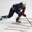 Team USA's captain Meghan Duggan #10 handles the puck in her game against Canada during the first period of their National Women's Team Series December 12, 2013 in Calgary, Alberta
