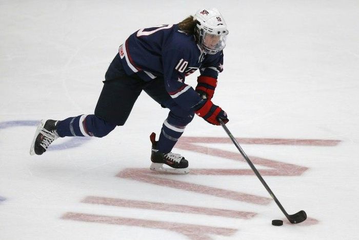 Team USA's captain Meghan Duggan #10 handles the puck in her game against Canada during the first period of their National Women's Team Series December 12, 2013 in Calgary, Alberta