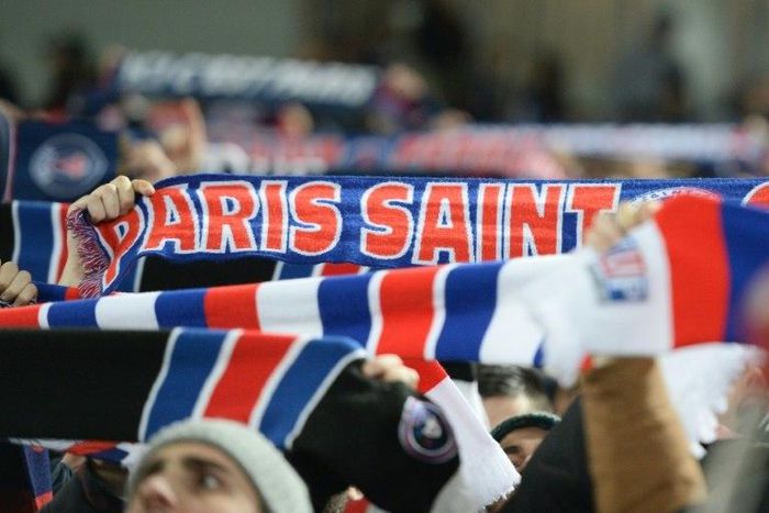 Paris Saint-Germain's fans hold scarves during the French Ligue 1 football match against Bordeaux February 10, 2017 at the Matmut Atlantique stadium