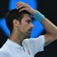 Novak Djokovic crashed out to unheralded Denis Istomin in five sets on Thursday in the world number two's earliest exit from a major since Wimbledon 2008
