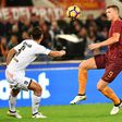 Roma's forward Edin Dzeko (R) faces off with Palermo's defender Edoardo Goldaniga on October 23, 2016
