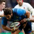 Italy's wing Giovanbattista Venditti dives over the line to score a try during the Six Nations international rugby union match between England and Italy at Twickenham stadium in London on February 26, 2017