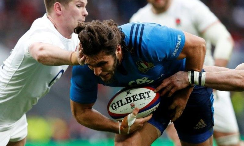 Italy's wing Giovanbattista Venditti dives over the line to score a try during the Six Nations international rugby union match between England and Italy at Twickenham stadium in London on February 26, 2017