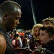 Usain Bolt signs autographs during the Nitro Athletics meet in Melbourne on February 9, 2017