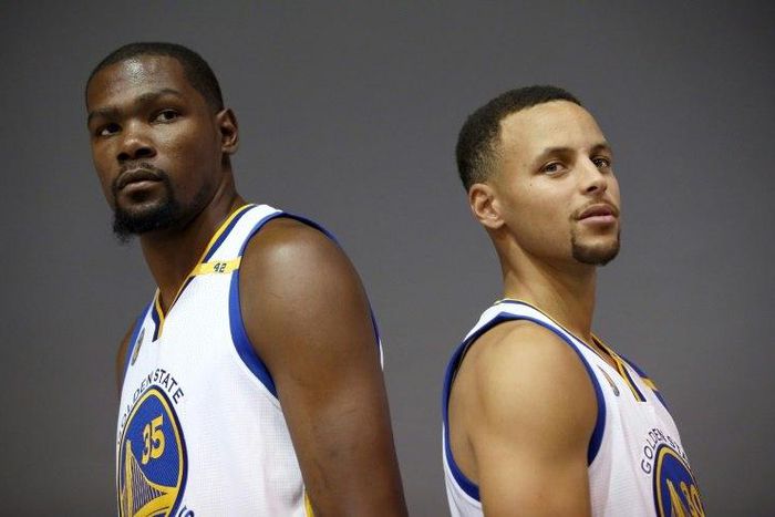 Kevin Durant #35 and Stephen Curry #30 of the Golden State Warriors pose during a media shoot at the Warriors Practice Facility on September 26, 2016 in Oakland, California