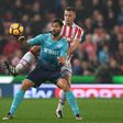 Swansea City's striker Fernando Llorente (L) vies with Stoke City's defender Ryan Shawcross during the English Premier League football match October 31, 2016