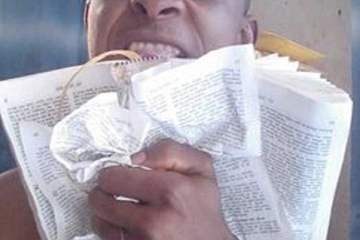 Udummiri Nwakalu tearing the Holy Bible