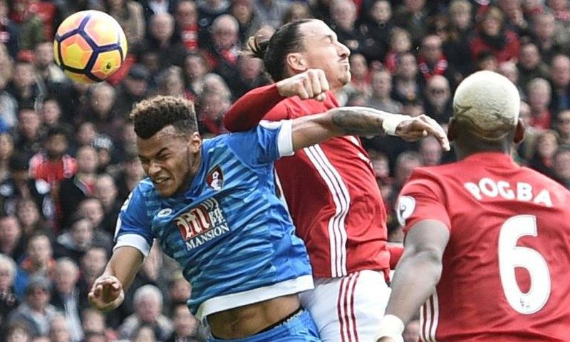 Mings (L) was suspended by the FA on Wednesday for standing on the head of the veteran forward Ibrahimovic (R) who then retaliated with an elbow (pictured)