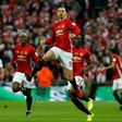 Manchester United's striker Zlatan Ibrahimovic (C) celebrates scoring the opening goal during the English League Cup final football match against Southampton February 26, 2017
