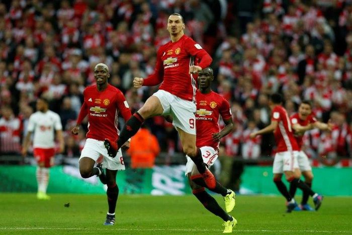 Manchester United's striker Zlatan Ibrahimovic (C) celebrates scoring the opening goal during the English League Cup final football match against Southampton February 26, 2017