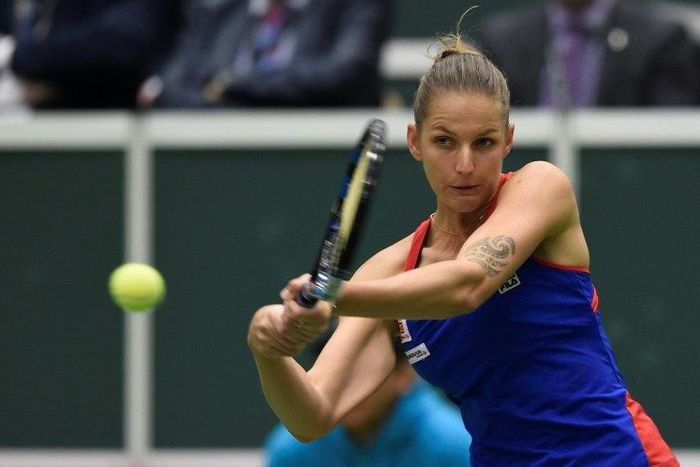 Karolina Pliskova of Czech Republic returns a ball to Garbine Muguruza of Spain during the Fed Cup on February 12, 2017 in Ostrava