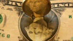 The dollar has tumbled after the Federal Reserve lifted interest rates but signalled a slower pace of increases this year