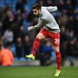 Liverpool's midfielder Adam Lallana warms up ahead of the English Premier League football match against Manchester City March 19, 2017
