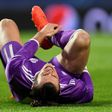 Real Madrid's Welsh forward Gareth Bale grimaces as he lies on the pitch during their match against Sporting CP in Lisbon on November 22, 2016