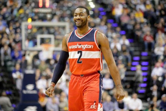 John Wall of the Washington Wizards celebrates scoring a point against the Indiana Pacers, at Bankers Life Fieldhouse in Indianapolis, Indiana, on February 16, 2017