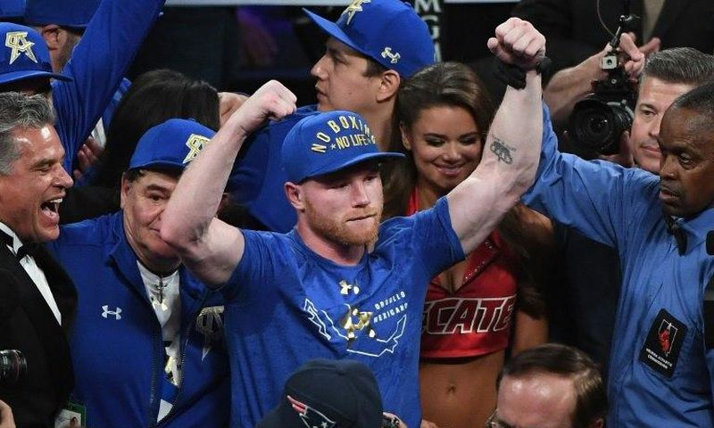 Saul 'Canelo' Alvarez celebrates after defeating Julio Cesar Chavez Jr. by unanimous decision in their catchweight bout, at T-Mobile Arena in Las Vegas, Nevada, on May 6, 2017