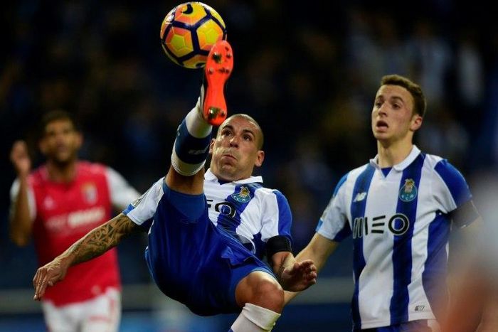 Porto's Uruguayan defender Maxi Pereira(L) in action against SC Braga: his team are chasing a Champions League spot