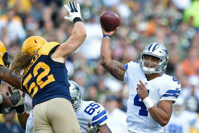 Clay Matthews of the Green Bay Packers attempts to block a pass attempt from Dak Prescott of the Dallas Cowboys during the second quarter at Lambeau Field on October 16, 2016 in Wisconsin