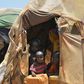 Internally displaced children pictured at the entrance of a hut at a makeshift camp on the outskirts of Baidoa, in the southwestern Bay region of Somalia, on March 14, 2017