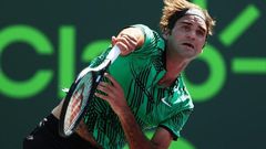 Roger Federer of Switzerland servest against Juan Martin Del Potro of Argentina during their Miami Open 3rd round match, at Crandon Park Tennis Center in Key Biscayne, Florida, on March 27, 2017