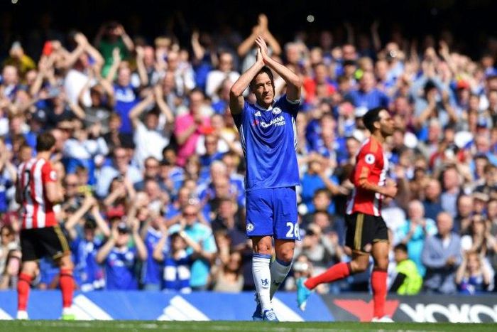 Chelsea's defender John Terry waves to the crowd as he is substituted off in the 26th minute at Stamford Bridge on May 21, 2017
