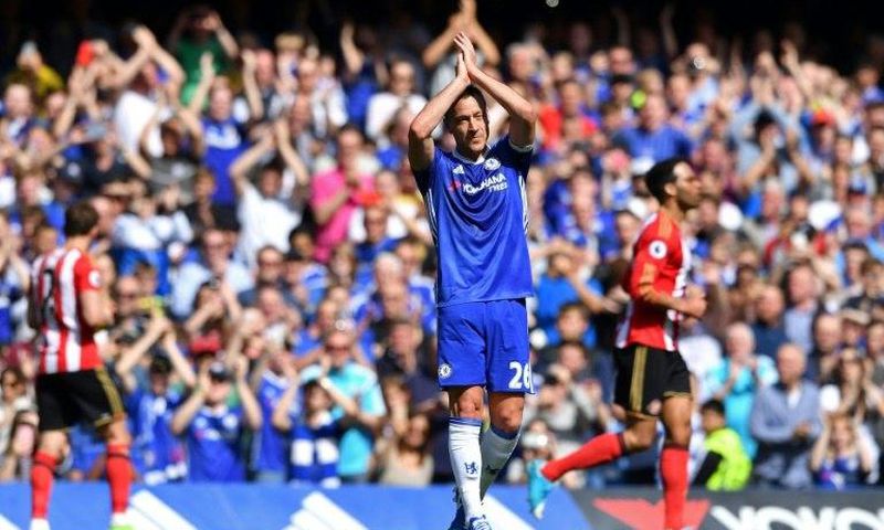 Chelsea's defender John Terry waves to the crowd as he is substituted off in the 26th minute at Stamford Bridge on May 21, 2017