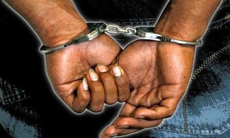 ___6211880___https:______static.pulse.com.gh___webservice___escenic___binary___6211880___2017___2___13___1___black-man-handcuffs--2-