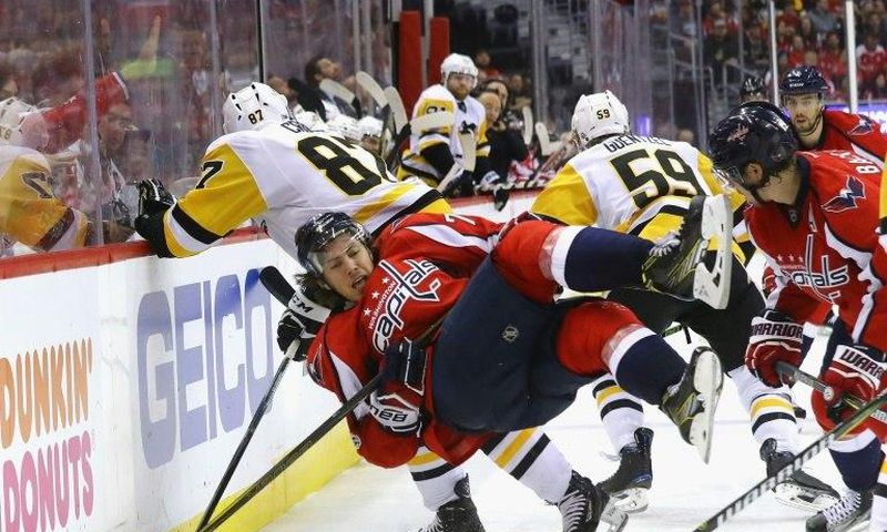 Sidney Crosby (No. 87) of the Pittsburgh Penguins checks T.J. Oshie of the Washington Capitals in Game Five of the NHL Eastern Conference 2nd round, at the Verizon Center in Washington, DC, on May 6, 2017