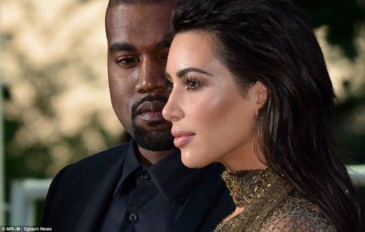 Kanye West and wife Kim Kardashian were all aglow for the Vogue 100 Festival in London.