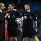 Manchester City's manager Pep Guardiola (2ndL) speaks with referee Michael Oliver after an English Premier League football match against Liverpool on March 19, 2017