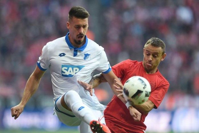 Hoffenheim's defender Ermin Bicakcic (L) and Bayern Munich's defender Rafinha clash for the ball on November 5, 2016
