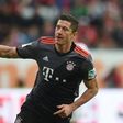 Bayern Munich's Polish striker Robert Lewandowski celebrates after his first goal for Munich during the German first division Bundesliga football match between FC Augsburg and FC Bayern Munich in Augsburg, southern Germany, on October 29, 2016