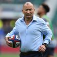 England's head coach Eddie Jones carries a rugby ball ahead of their Six Nations match against Scotland at Twickenham stadium in south west London on March 11, 2017