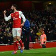 Arsenal striker Olivier Giroud (L) celebrates scoring a goal team manager Arsene Wenger has called a work of art