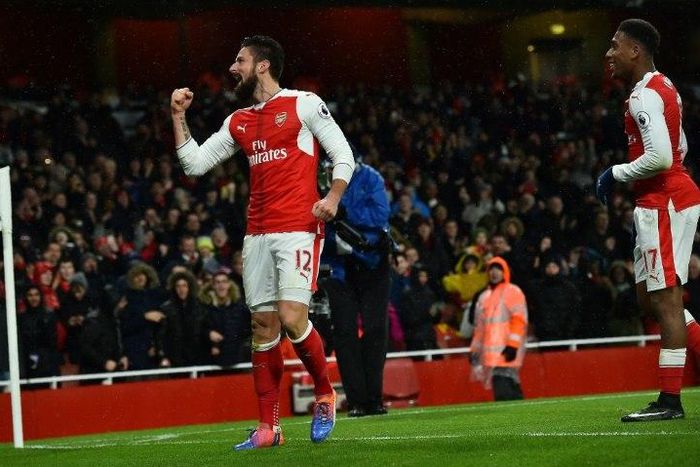 Arsenal striker Olivier Giroud (L) celebrates scoring a goal team manager Arsene Wenger has called a work of art