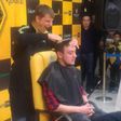 Andre Arshavin shaves blogger's head